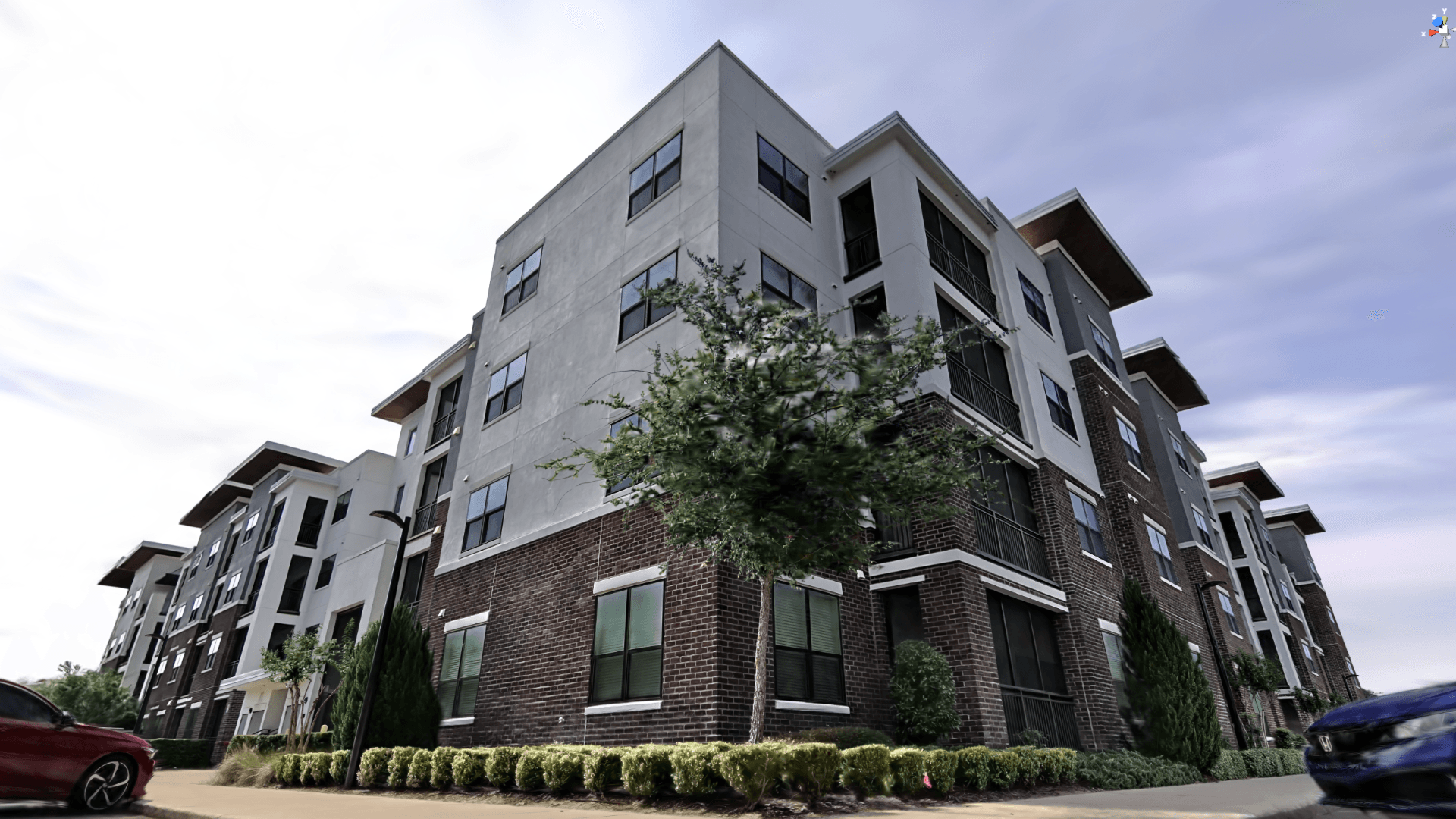 Photorealistic 3D Gaussian Splatting render of the same apartment building