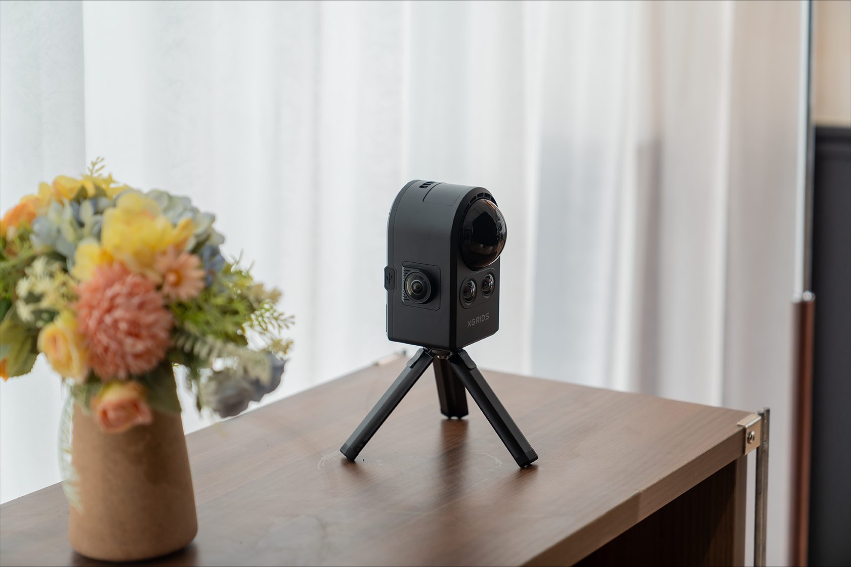 Lixel K1 on a tripod in a styled interior