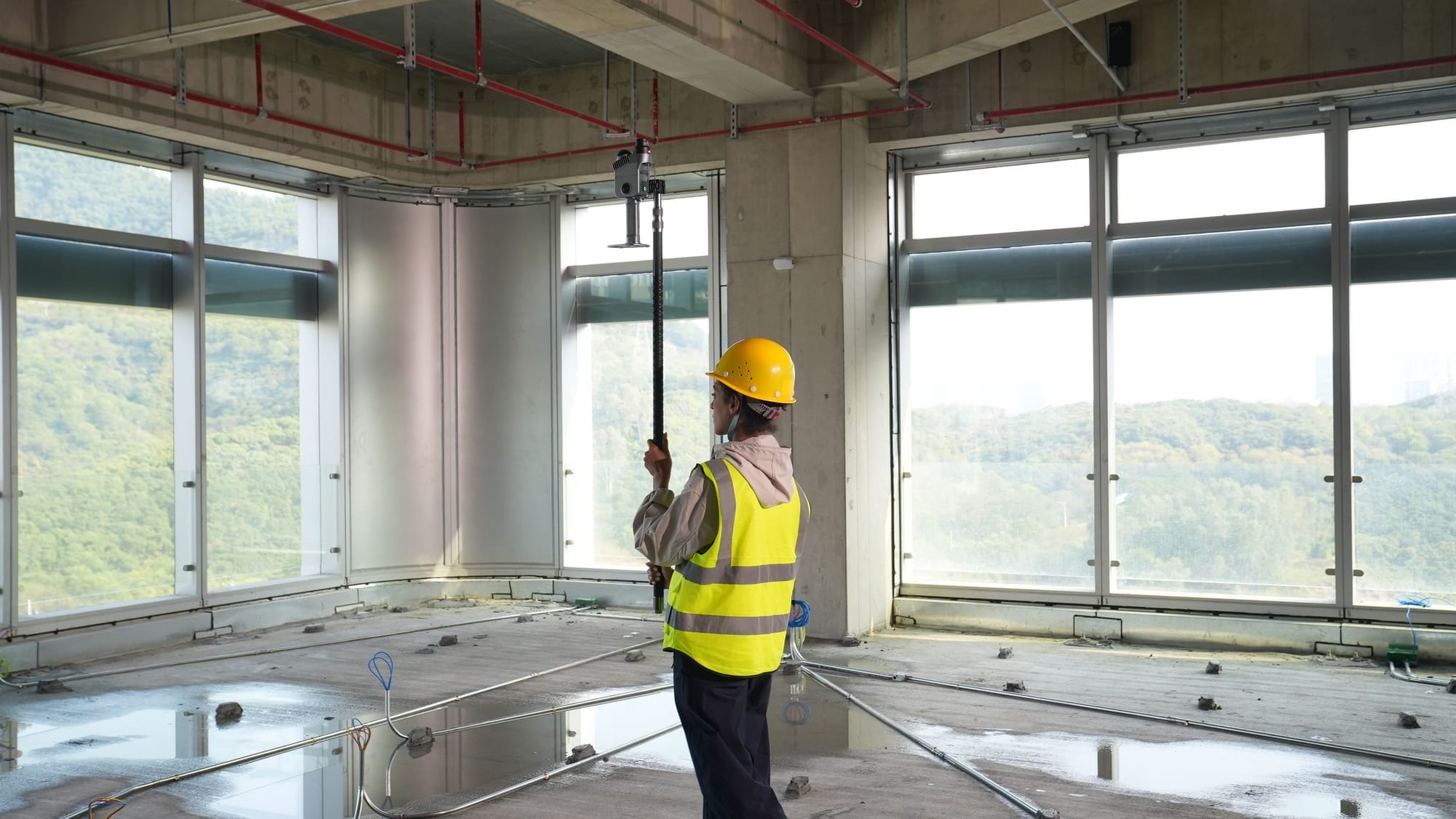 Scanning a ceiling overhead on a construction site