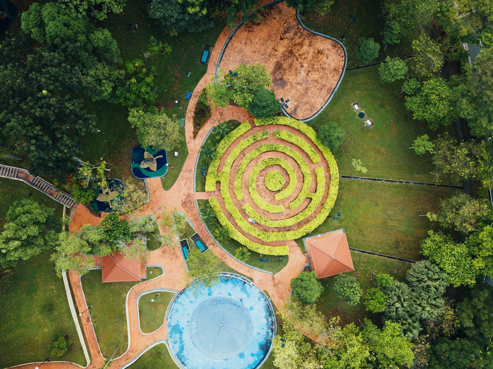 Aerial view of a formal circular garden with a hedge maze
