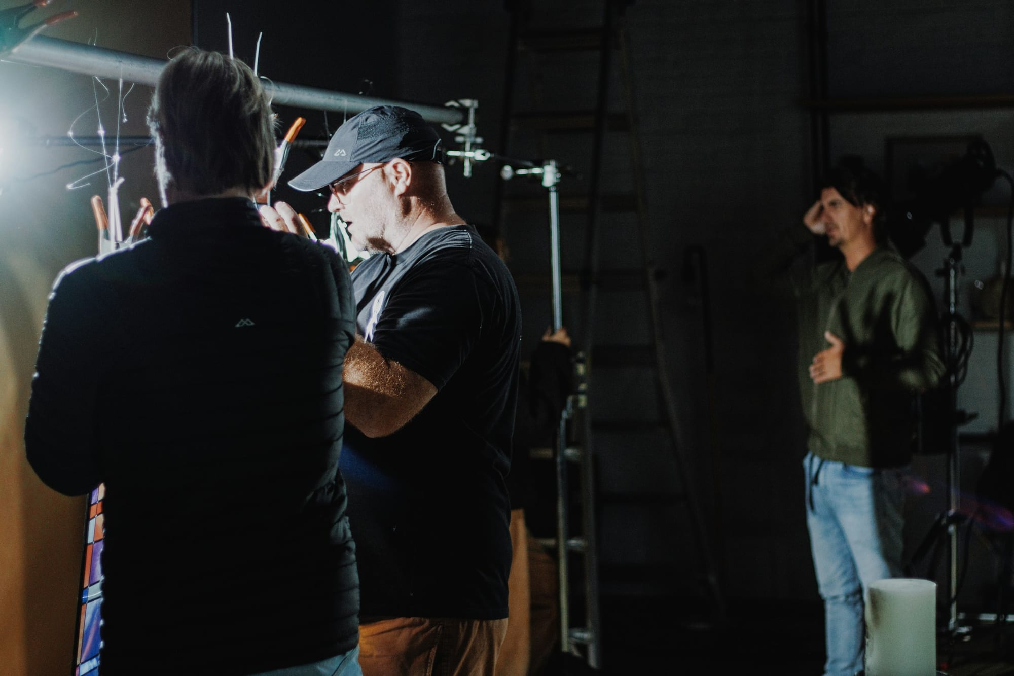 Film crew setting up a lighting rig on set